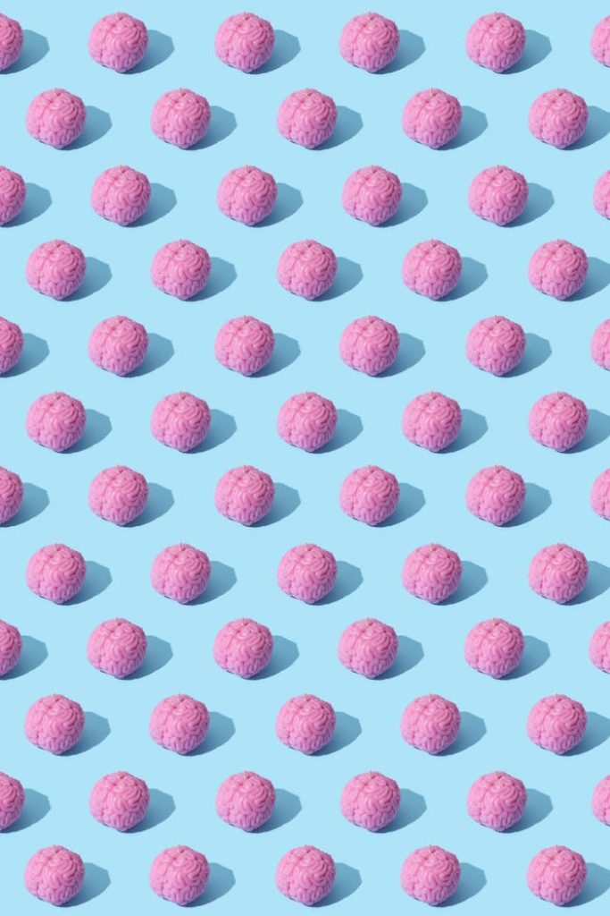 Colorful pattern with pink spheres on a light blue background in vibrant pop-art style.